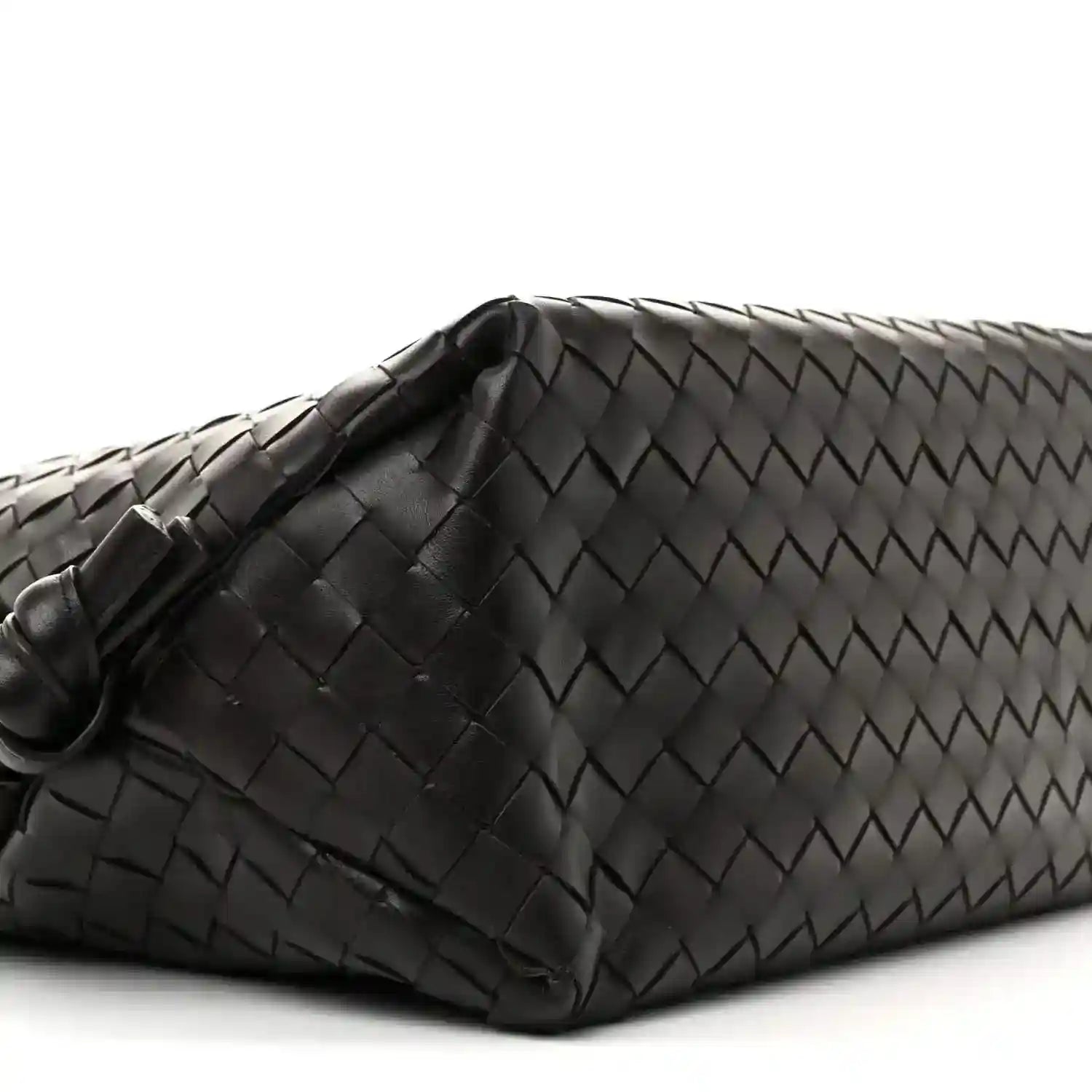 Black woven leather weekender bag end with folded corner and braided texture