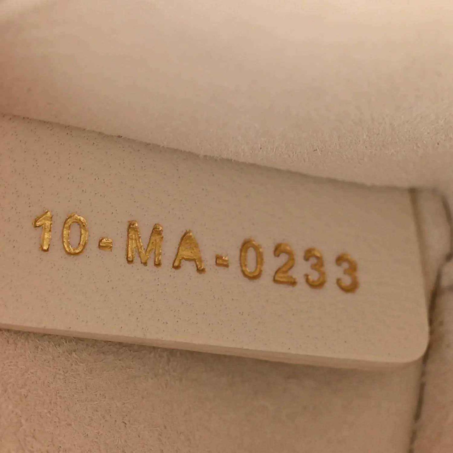 Cream interior label with code 10.MA.0233