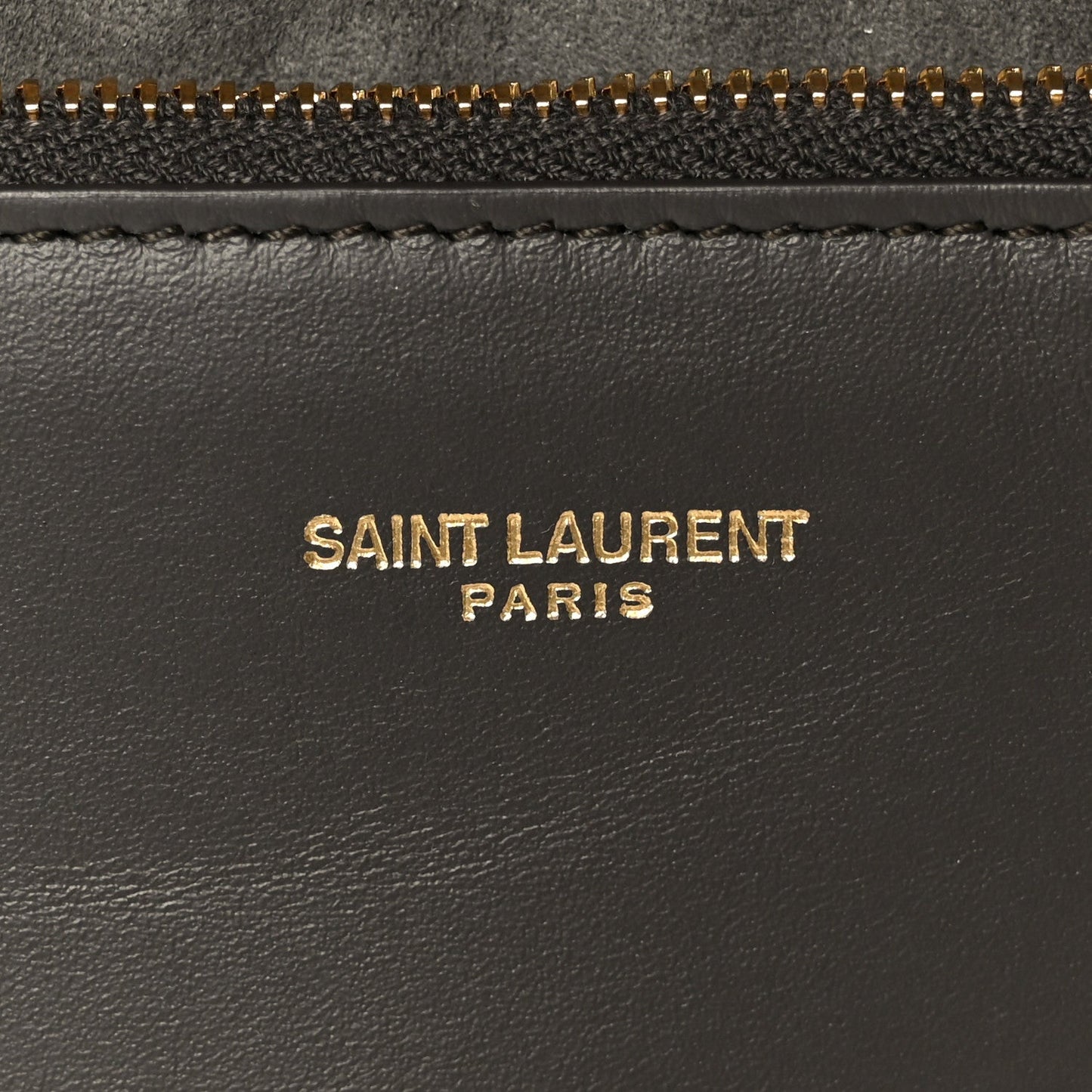 Saint Laurent Paris logo on black leather with gold zipper trim
