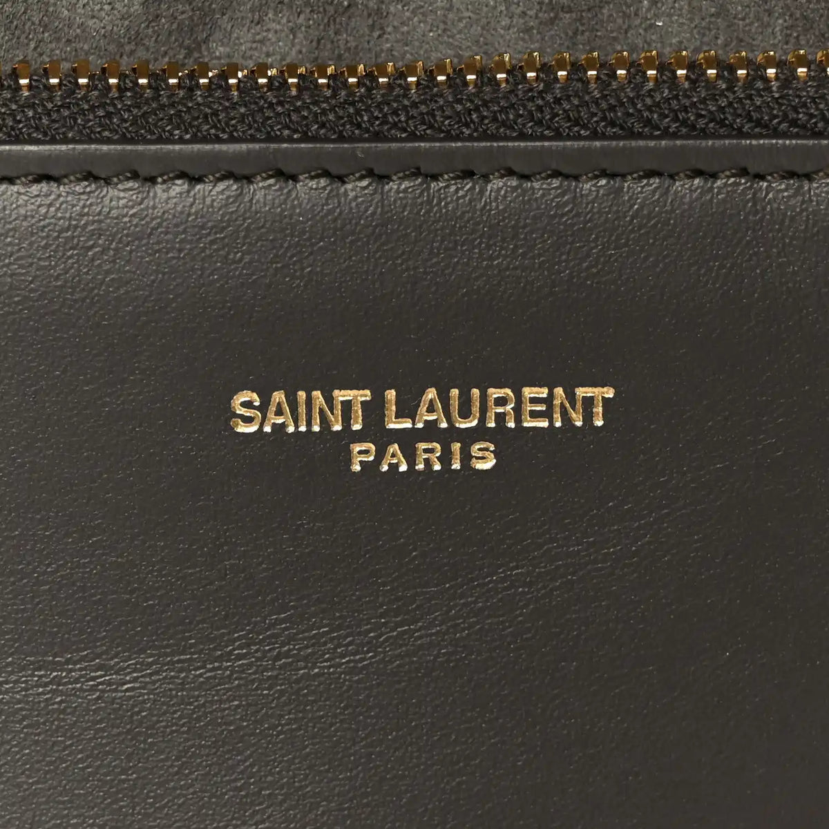 Saint Laurent Paris logo on black leather with gold zipper trim