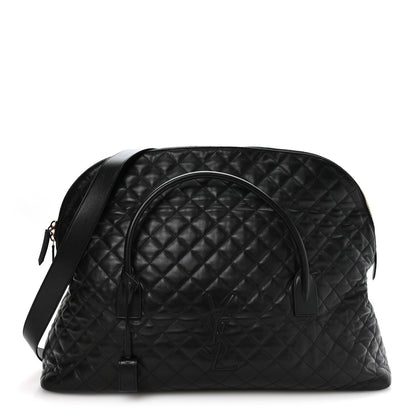 Black quilted leather travel bag with curved top handle and zip closure, gold hardware