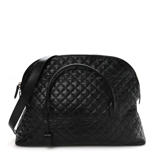 Black quilted leather travel bag with curved top handle and zip closure, gold hardware