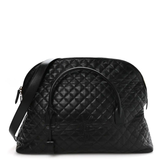 Black quilted leather travel bag with curved top handle and zip closure, gold hardware