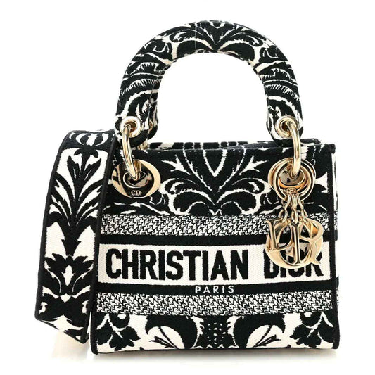 Mini embroidered canvas bag, black and white floral print with gold-tone top handles