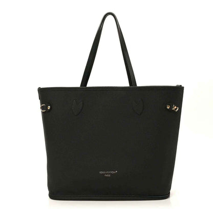 Black tote bag with subtle embossed pattern and gold-tone hardware