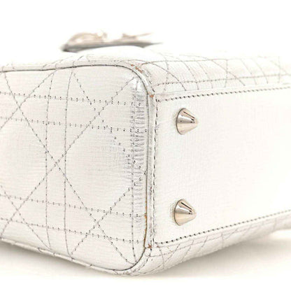My Lady Dior handbag side panel with two snap studs and quilted lattice texture