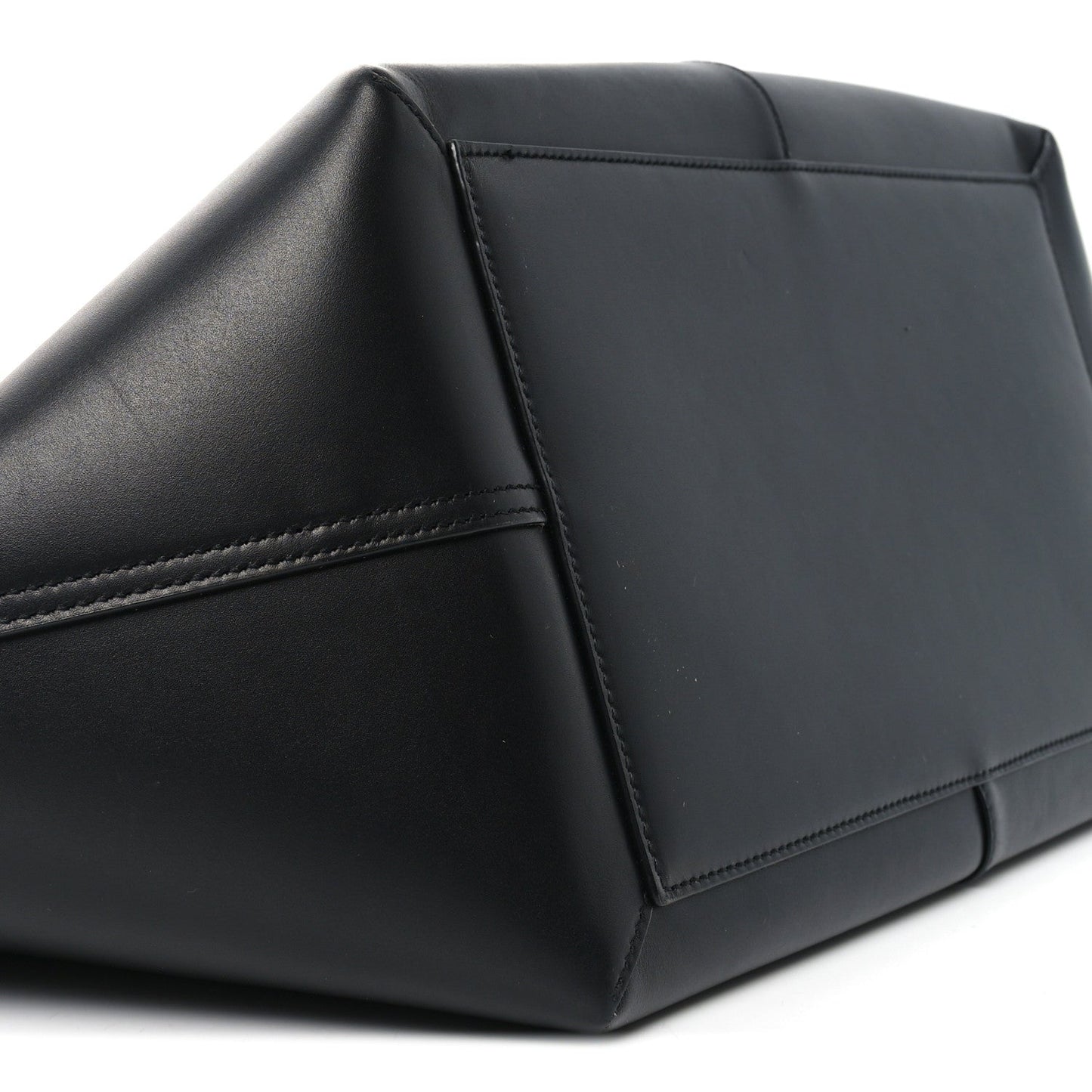 Black smooth calfskin tote corner with reinforced stitching and structured panel