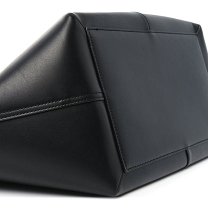 Black smooth calfskin tote corner with reinforced stitching and structured panel