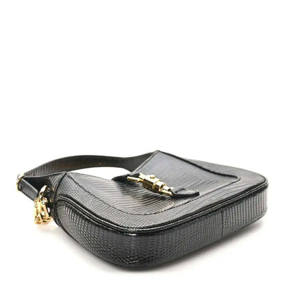 Black lizard mini Jackie handbag with top flap, gold-tone clasp, and chain shoulder strap.