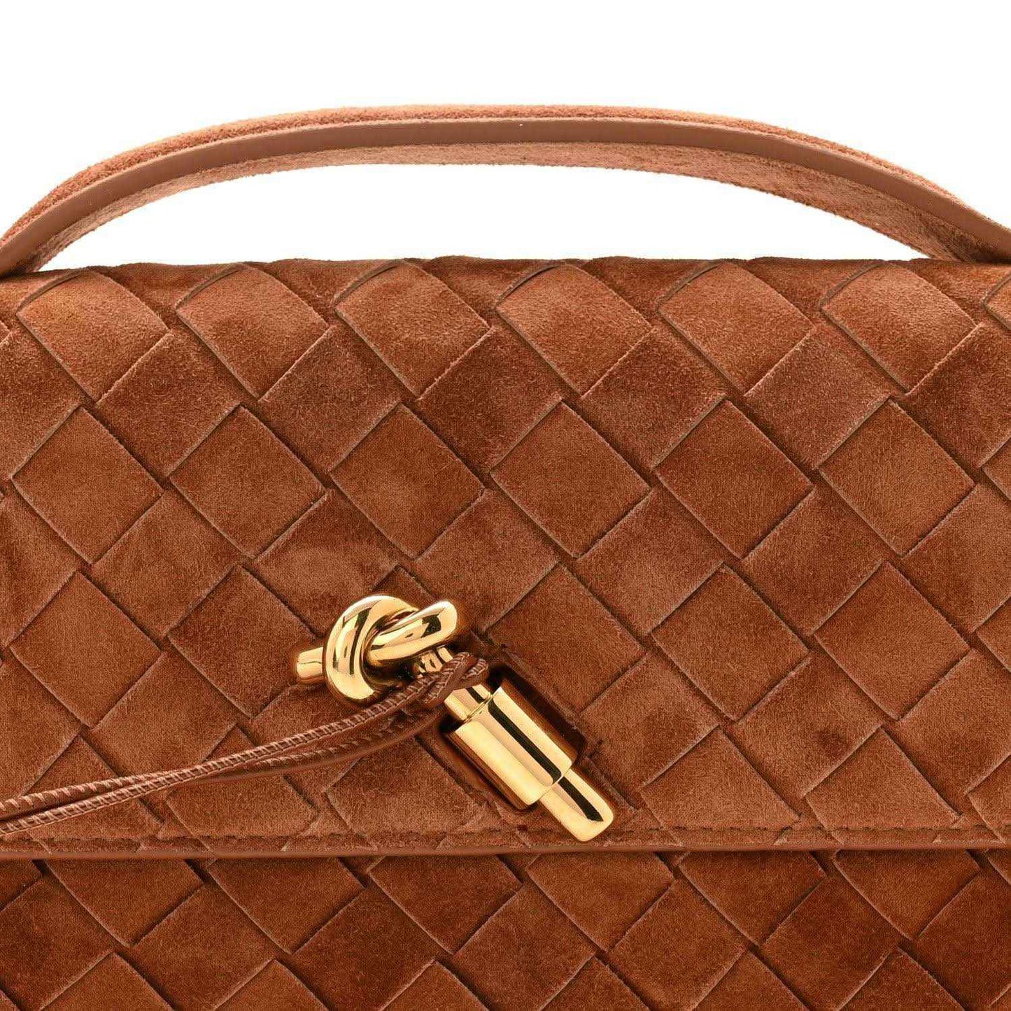 Gold-tone clasp on amber-brown suede intrecciato clutch flap