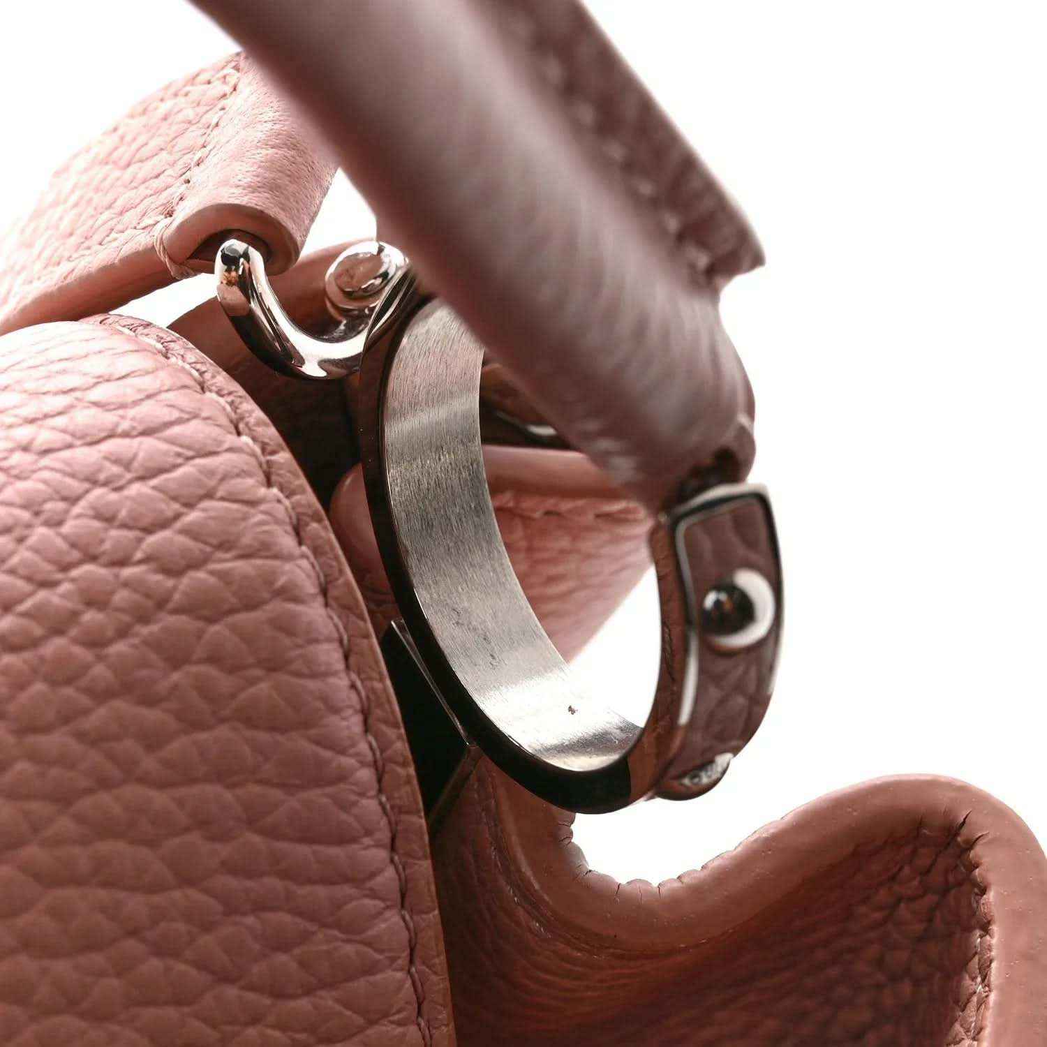 Pink pebbled leather handbag clasp with silver-tone hook and leather strap
