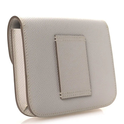 Pale gray leather slim wallet with fold-over flap and stitched front pocket