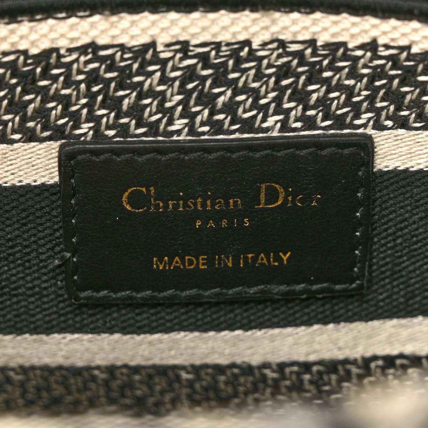 Interior brand label reading Christian Dior Paris and made in Italy on fabric tab.