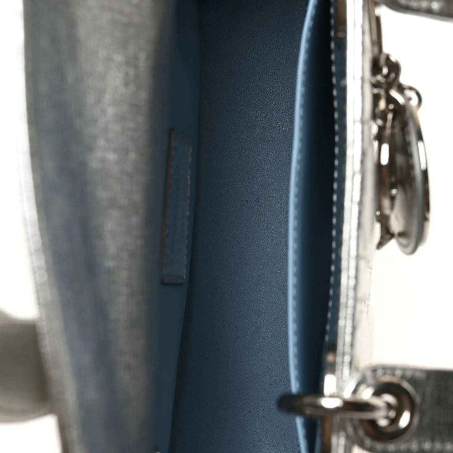 Blue leather bag panel with zipper track and metal ring hardware