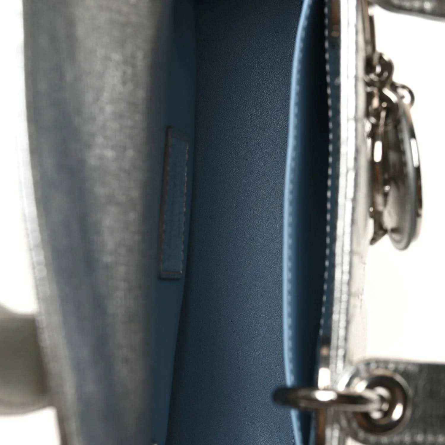 Blue leather bag panel with zipper track and metal ring hardware
