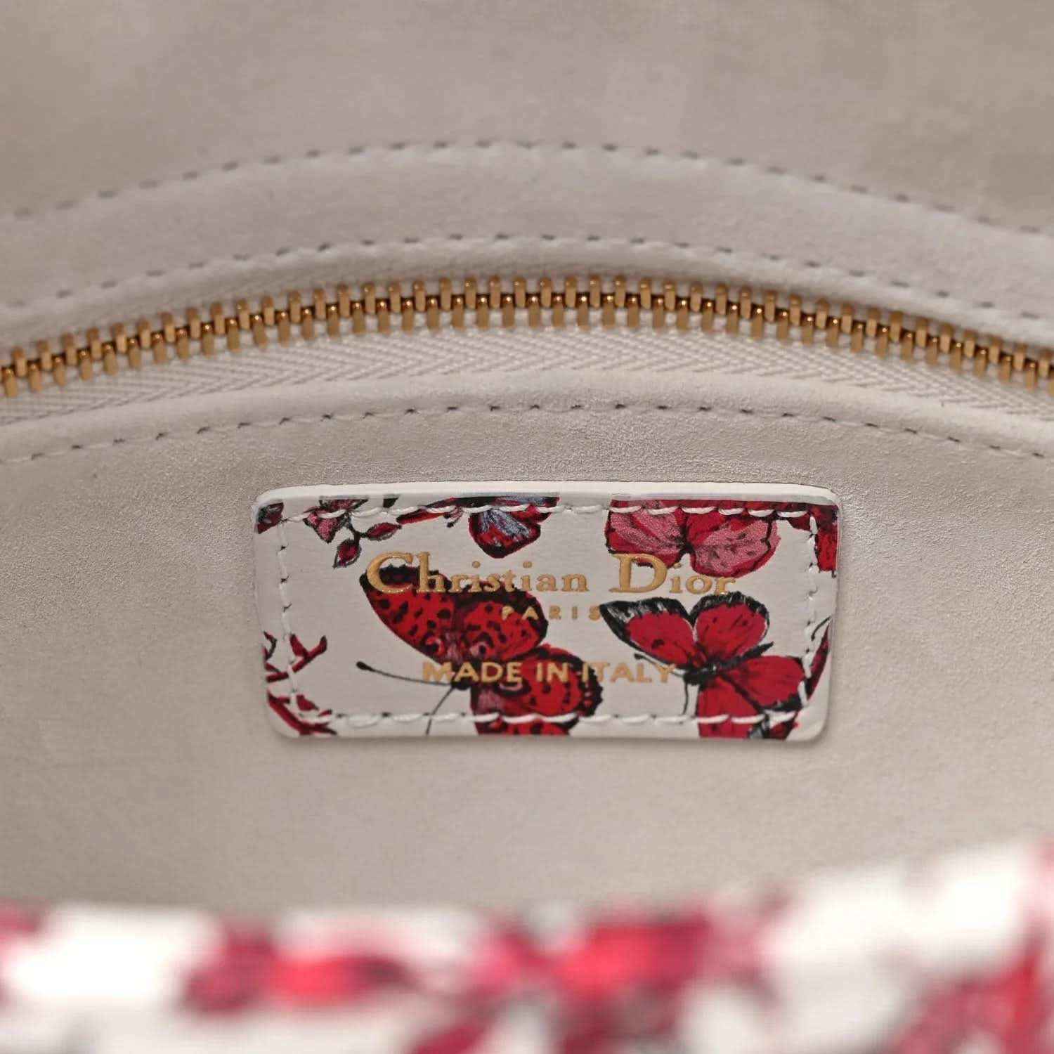 Handbag interior label showing Christian Dior and Made in Italy, gold zipper detail