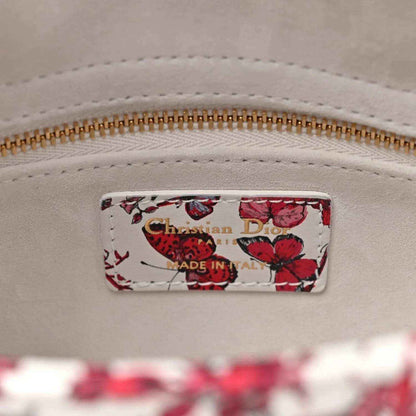 Handbag interior label showing Christian Dior and Made in Italy, gold zipper detail