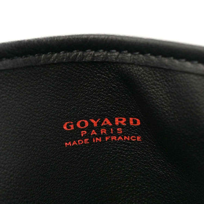 Black leather close-up with "GOYARD" "PARIS" "MADE IN FRANCE" logo