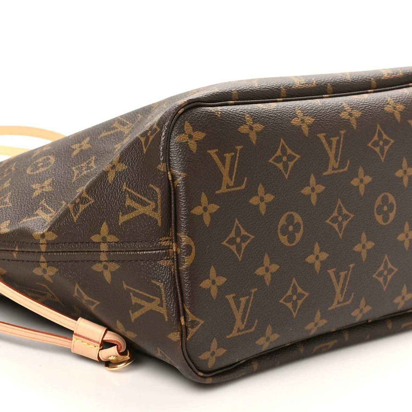 Louis Vuitton monogram tote bag side close-up, dark brown canvas with tan zipper trim