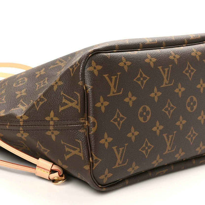 Louis Vuitton monogram tote bag side close-up, dark brown canvas with tan zipper trim