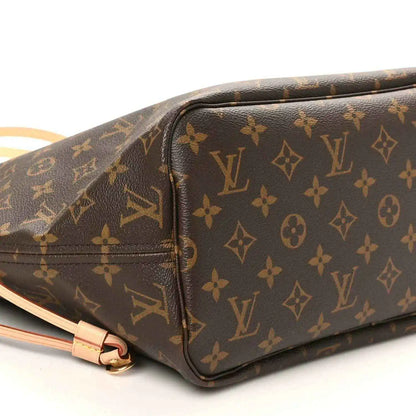 Louis Vuitton monogram tote bag side close-up, dark brown canvas with tan zipper trim