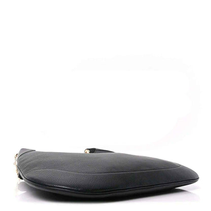 Black grained leather maxi hobo bag with curved top edge and metal hardware