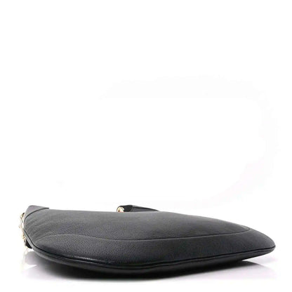 Black grained leather maxi hobo bag with curved top edge and metal hardware
