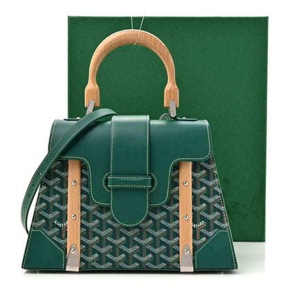 Goyardine Saigon PM bag with green handles, patterned canvas front, and top clasp