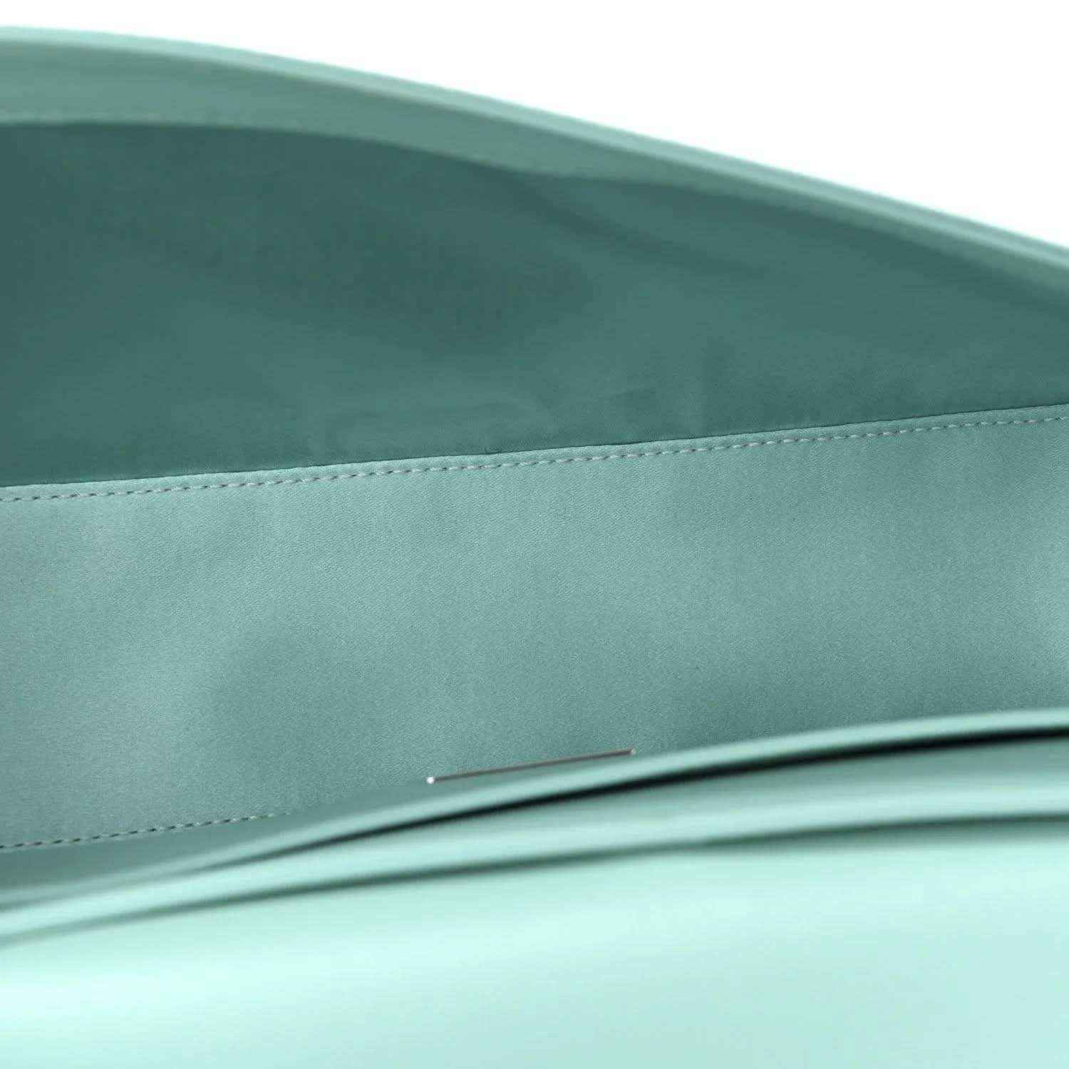 Blue satin baguette bag close-up of front edge and top seam detail