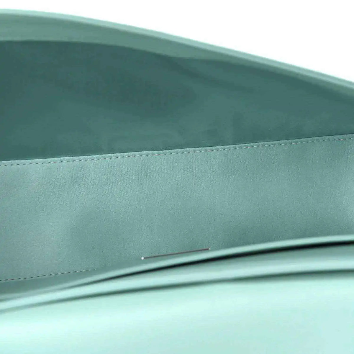 Blue satin baguette bag close-up of front edge and top seam detail