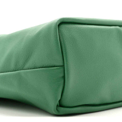 Reversible mini tote bag corner in solid green with stitched seam