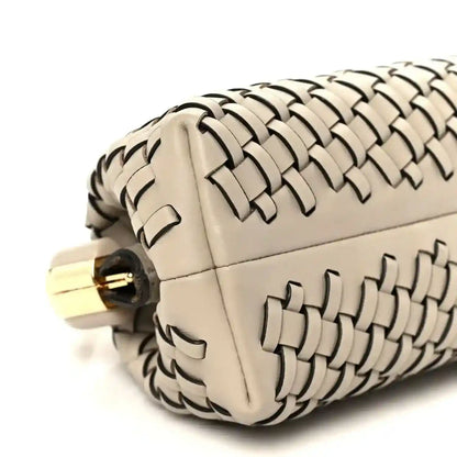 Ivory woven leather clutch with gold-tone clasp and structured rounded sides