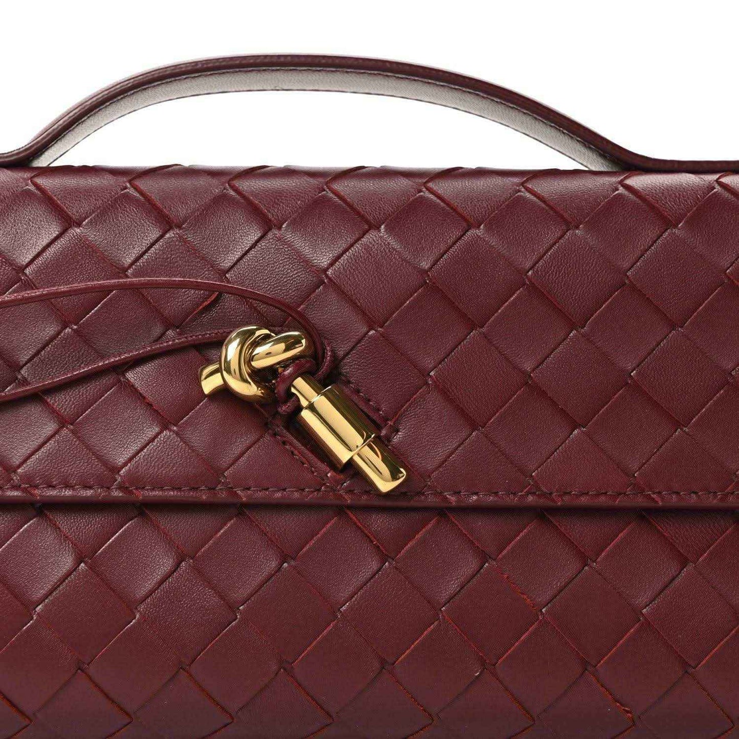 Bottega Veneta intrecciato clutch flap with gold clasp and top handle in barolo