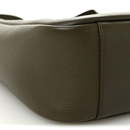 Calfskin hobo bag side panel detail with smooth grain texture and seams.
