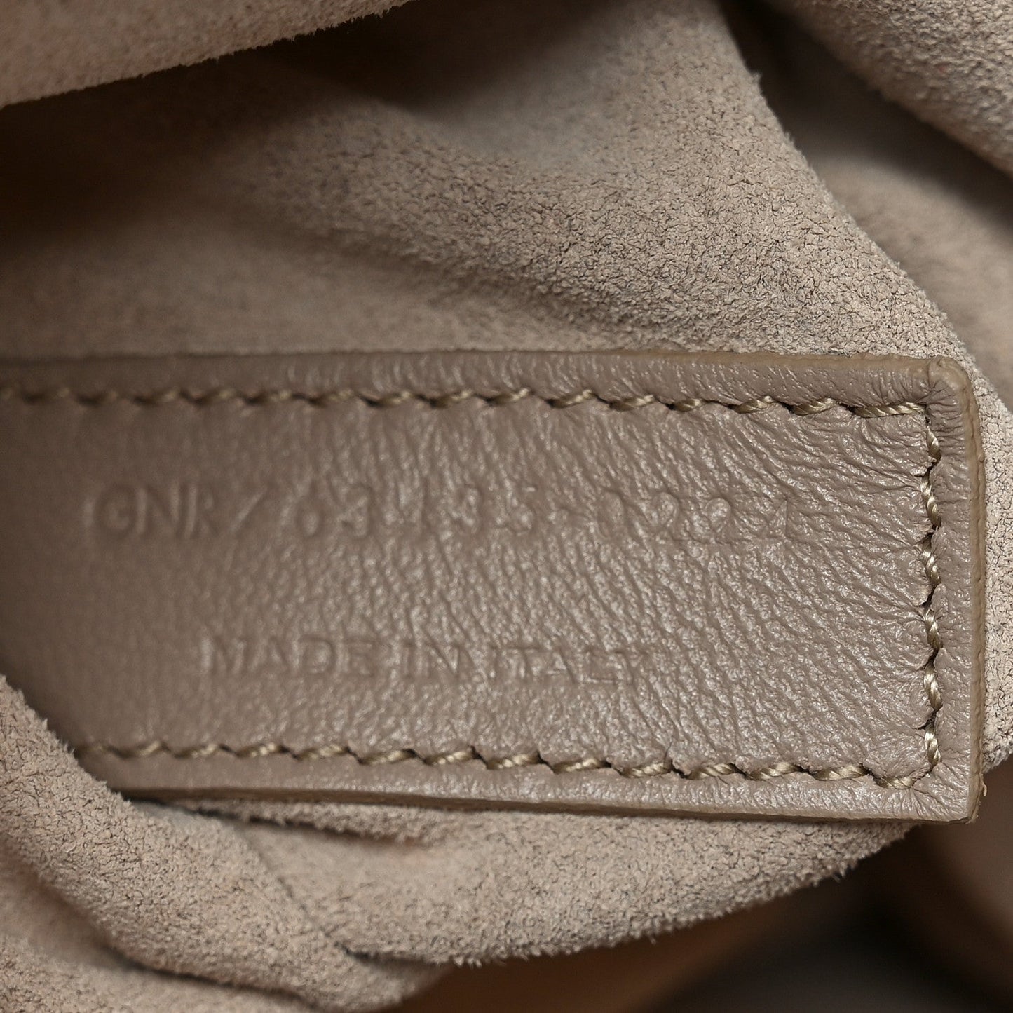 Close-up of tote bag interior stitching and leather edge construction