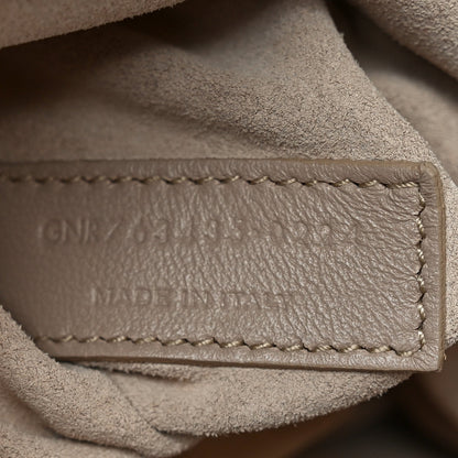 Close-up of tote bag interior stitching and leather edge construction