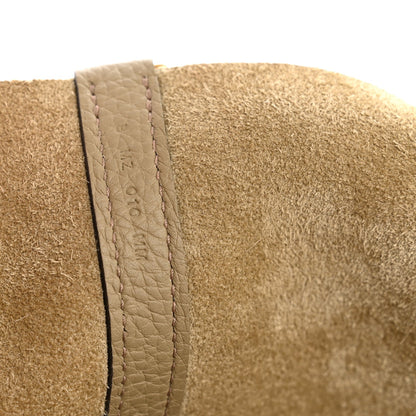 Beige suede lining panel with stitched leather edge