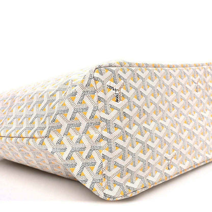 White and yellow patterned tote bag corner with stitched trim