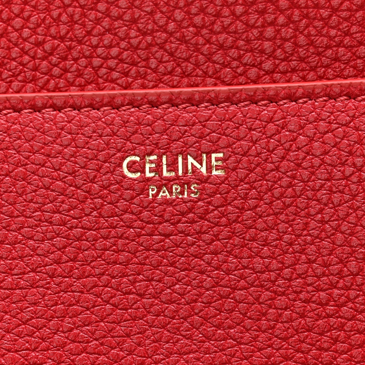 Red grained leather panel with CELINE PARIS logo embossing