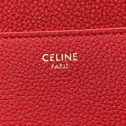 Red grained leather panel with CELINE PARIS logo embossing