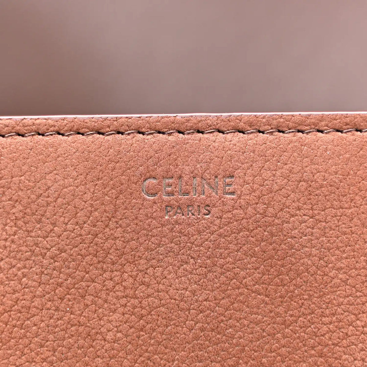Chestnut leather interior panel with embossed CELINE PARIS lettering