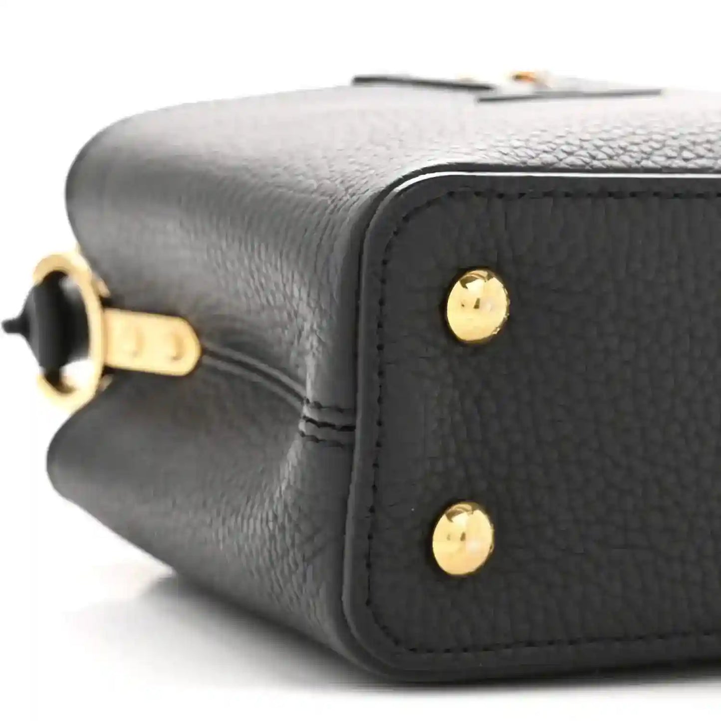 Black textured leather mini bag side with gold-tone studs and top handle hardware