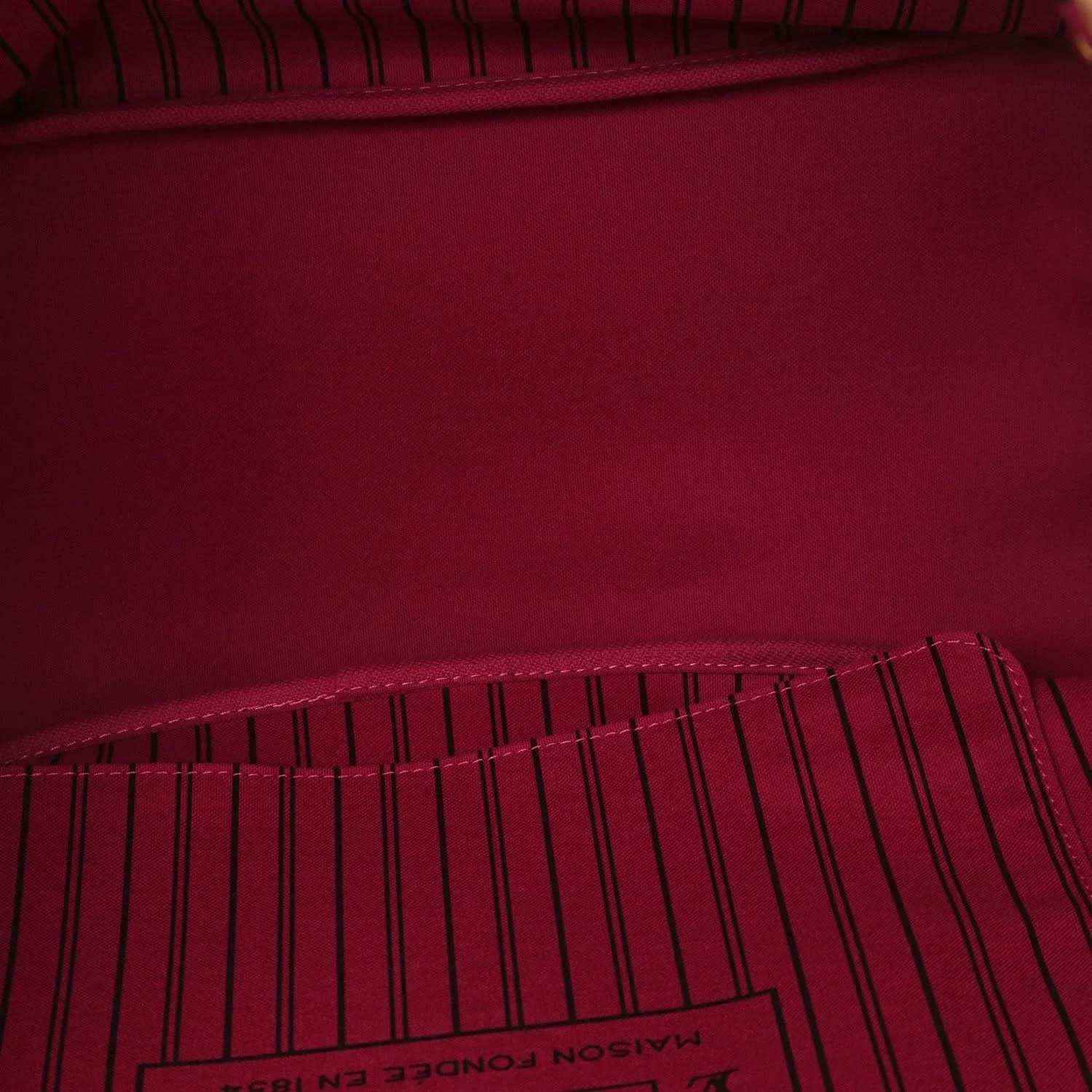 Tote bag interior lining in deep burgundy with stitched edge seam