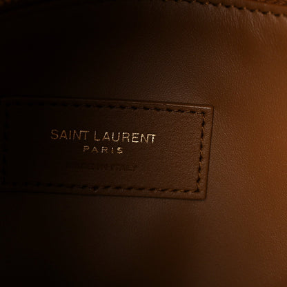 Saint Laurent hobo bag interior label reading "SAINT LAURENT PARIS" on brown lining