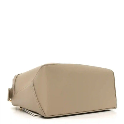 Small Puzzle edge bag underside, soft white and beige calfskin with rounded base