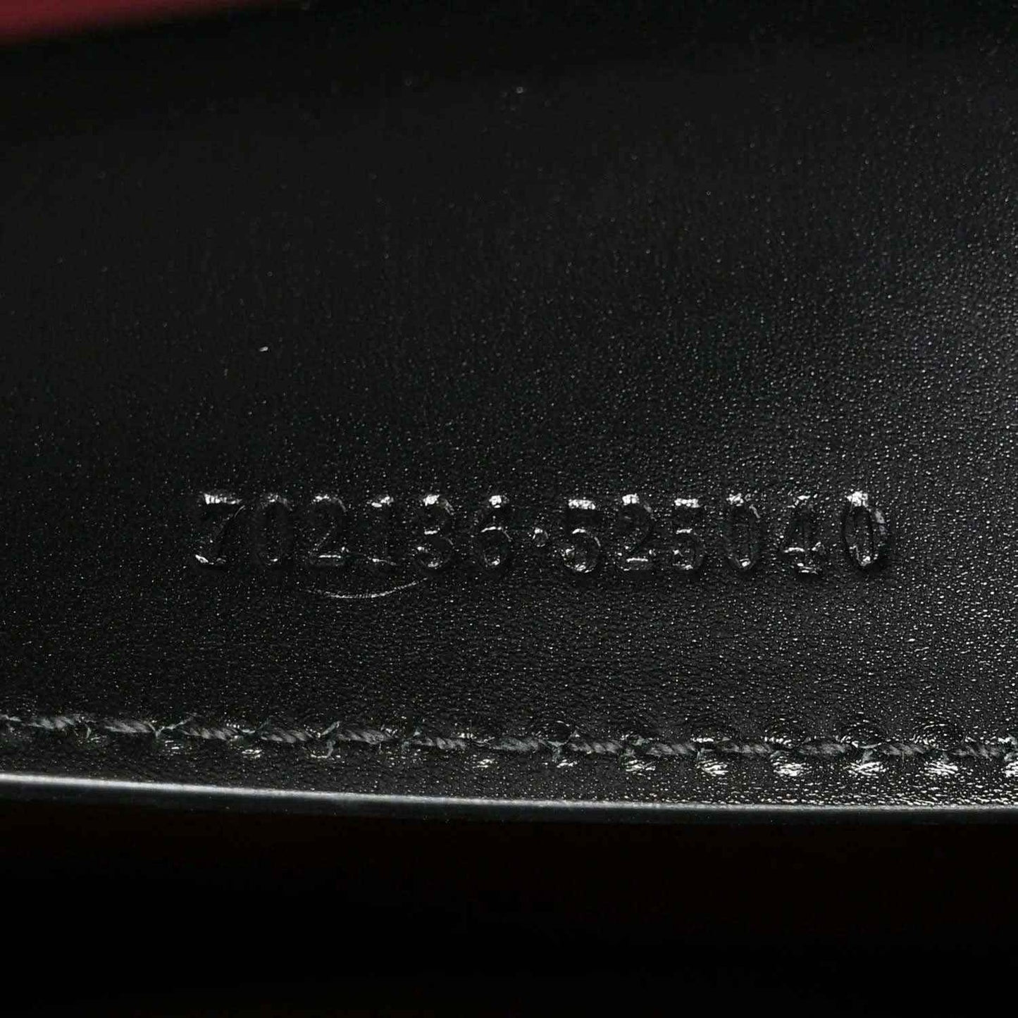 Black leather base stamp reading 3123555140 and Made in Italy