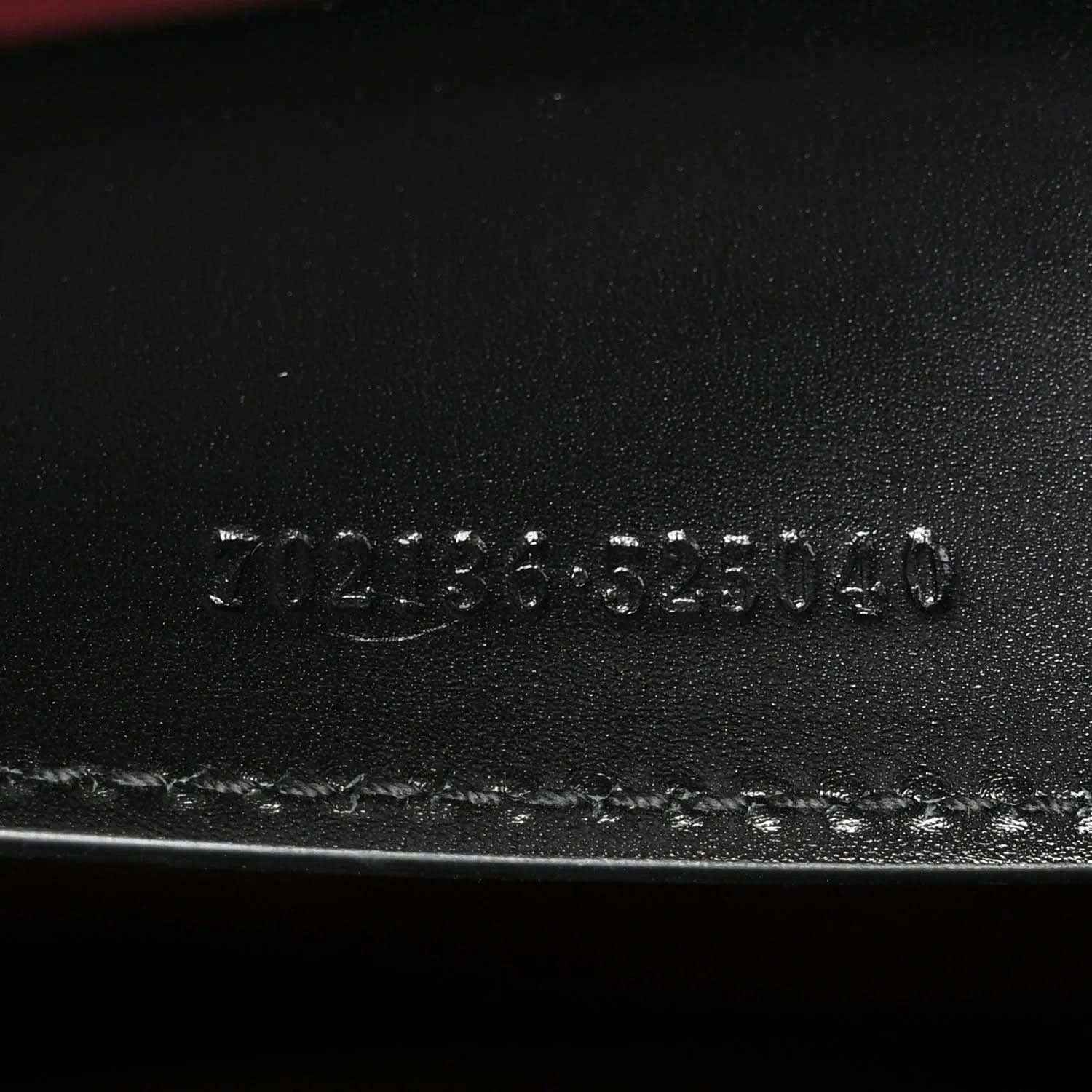 Black leather base stamp reading 3123555140 and Made in Italy