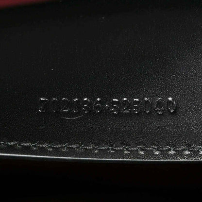 Black leather base stamp reading 3123555140 and Made in Italy