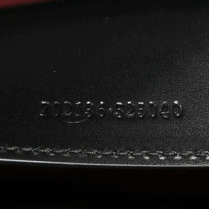 Black leather base stamp reading 3123555140 and Made in Italy