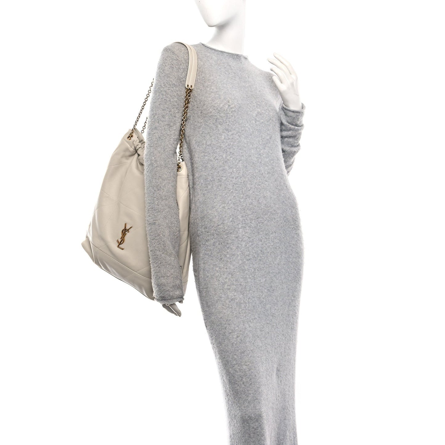 Cream lambskin tote bag with chain handle and YSL logo, draped side view